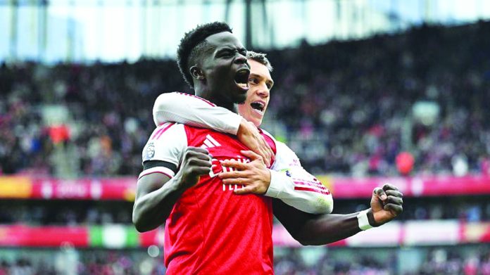 Saka Sends Arsenal Top as Liverpool Fall at Chelsea