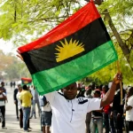 A-supporter-of-Indigenous-People-of-Biafra-IPOB-leader-Nnamdi-Kanu-holds-a-Biafra-flag-during-a-rally-in-support-of-Kanu-1536x864
