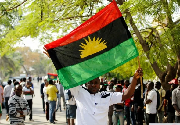 A-supporter-of-Indigenous-People-of-Biafra-IPOB-leader-Nnamdi-Kanu-holds-a-Biafra-flag-during-a-rally-in-support-of-Kanu-1536x864